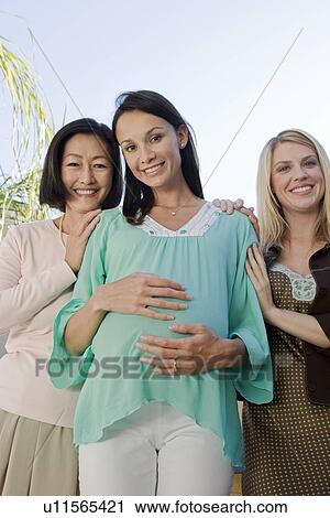 Women standing outside celebrating a Baby Shower View Large Photo Image Stock Image - Women standing outside celebrating a Baby Shower. Fotosearch