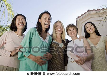 Women standing outside celebrating a Baby Shower View Large Photo Image Stock Photo - Women standing outside celebrating a Baby Shower. Fotosearch