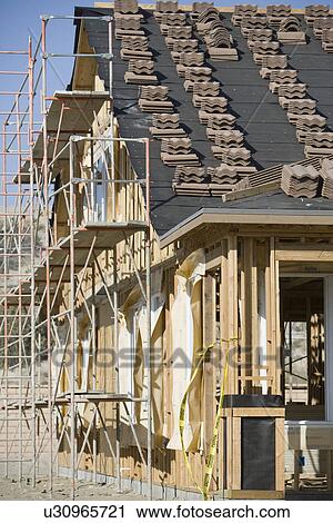 Wooden house construction View Large Photo Image Stock Image - Wooden house construction. Fotosearch