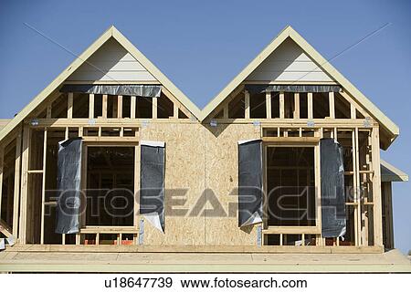 Wooden house construction View Large Photo Image Stock Photo - Wooden house construction. Fotosearch