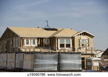 Stock Photograph - Wooden house construction. Fotosearch