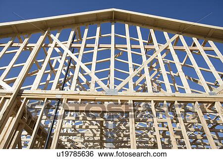 Stock Photograph - Wooden house construction. Fotosearch
