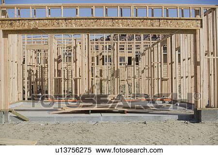 Wooden house construction View Large Photo Image Stock Photography - Wooden house construction. Fotosearch