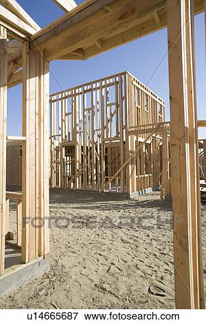 Stock Photo - Wooden house constructions. Fotosearch