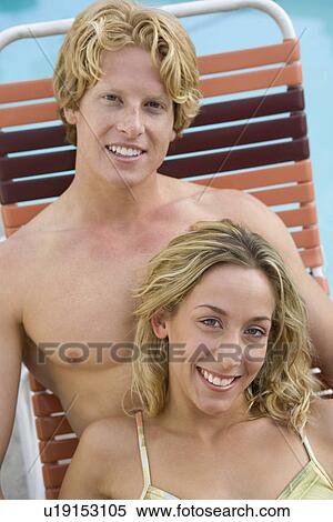 Young Couple on Sunlounger by Pool View Large Photo Image Stock Photography - Young Couple on Sunlounger by Pool. Fotosearch