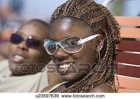 Stock Photo - Young Couple Relaxing Outdoors. Fotosearch