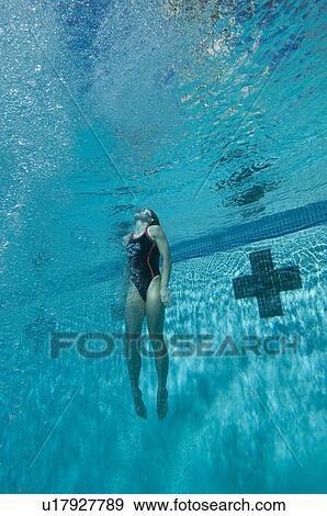 Stock Photo - Young female swimmer in swimming pool. Fotosearch