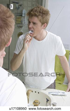 Young Man Brushing Teeth View Large Photo Image Stock Image - Young Man Brushing Teeth. Fotosearch