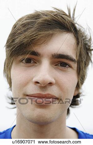 Stock Image - Young man outside, close-up, portrait. Fotosearch
