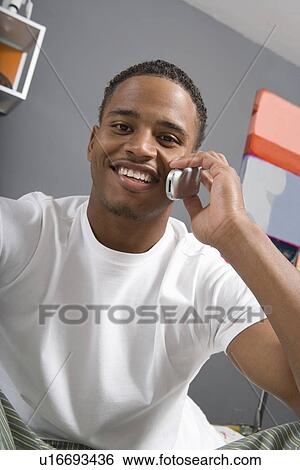 Young Man Using Cell Phone View Large Photo Image Stock Photograph - Young Man Using Cell Phone. Fotosearch