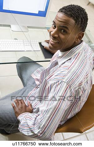 Young Man Using Desktop Computer View Large Photo Image Stock Image - Young Man Using Desktop Computer. Fotosearch