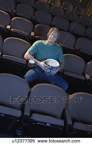 Young Man Watching Movie View Large Photo Image Stock Photography - Young Man Watching Movie. Fotosearch