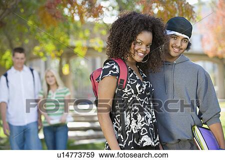Stock Photo - Young student couple on campus, (portrait). Fotosearch