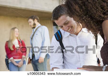 Young students having a break View Large Photo Image Stock Image - Young students having a break. Fotosearch