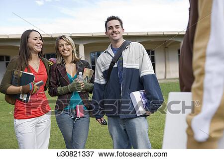 Stock Photo - Young students having a break. Fotosearch