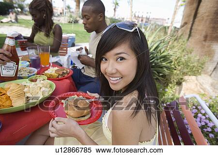 Stock Photography - Young Woman at Barbecue, Portrait. Fotosearch