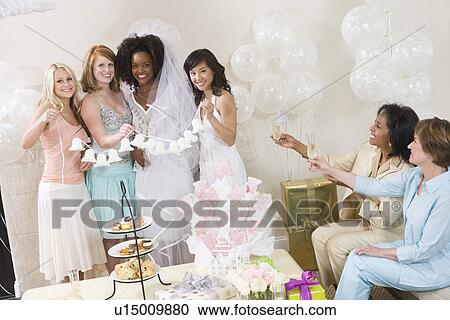 Young woman celebrating bridal shower with friends View Large Photo Image Stock Image - Young woman celebrating bridal shower with friends. Fotosearch