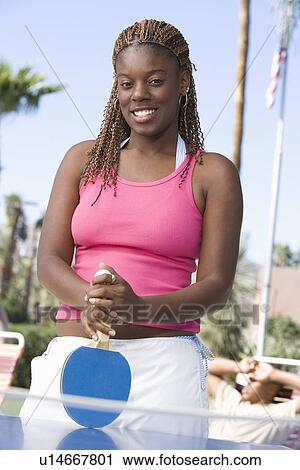 Young woman playing table tennis, portrait View Large Photo Image Stock Image - Young woman playing table tennis, portrait. Fotosearch