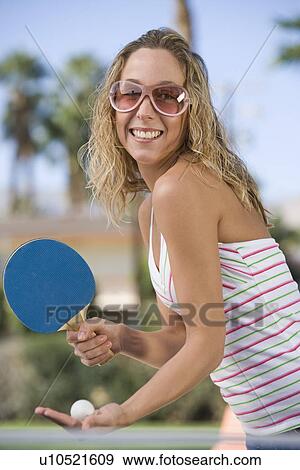 Young woman playing table tennis, portrait View Large Photo Image Stock Photo - Young woman playing table tennis, portrait. Fotosearch