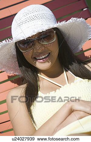 Stock Photo - Young Woman Relaxing Outdoors, Portrait. Fotosearch