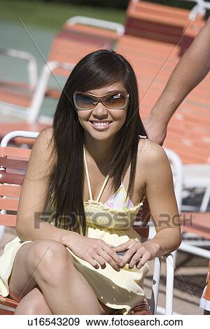 Stock Photo - Young Woman Relaxing Outdoors. Fotosearch