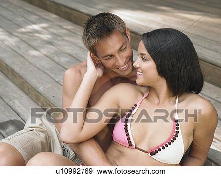 Affectionate Young Couple Relaxing on Terrace View Large Photo Image Stock Photo - Affectionate Young Couple Relaxing on Terrace. Fotosearch