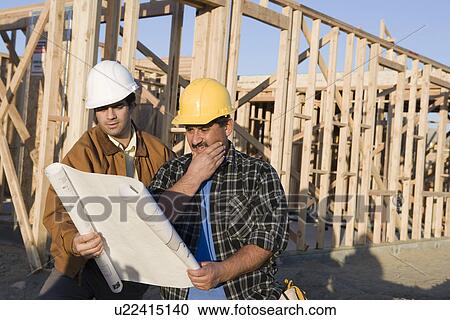 Architect with construction worker in construction site View Large Photo Image Stock Image - Architect with construction worker in construction site. Fotosearch