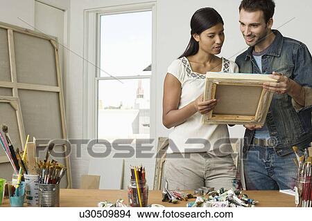 Artists Looking at Canvas in Studio View Large Photo Image Picture - Artists Looking at Canvas in Studio. Fotosearch