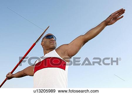 Athlete about to throw javelin, half length View Large Photo Image Stock Photo - Athlete about to throw javelin, half length. Fotosearch