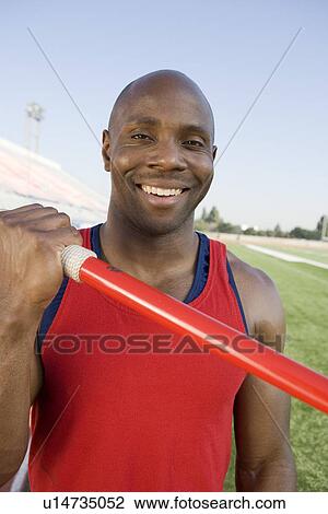 Athlete holding javelin View Large Photo Image Stock Image - Athlete holding javelin. Fotosearch