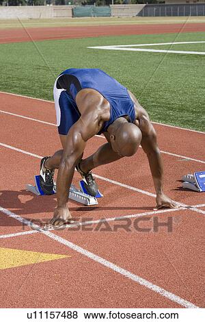 Athlete ready to run View Large Photo Image Stock Photo - Athlete ready to run. Fotosearch