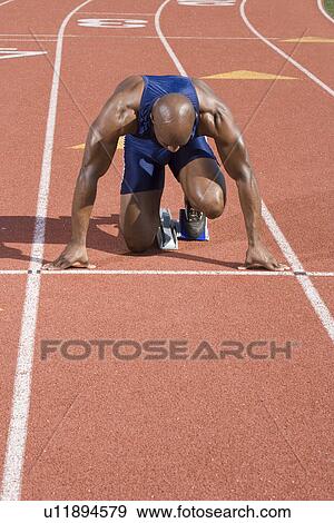 Stock Photo - Athlete ready to run. Fotosearch