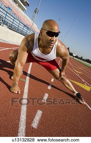 Athlete warming up before run View Large Photo Image Stock Photo - Athlete warming up before run. Fotosearch
