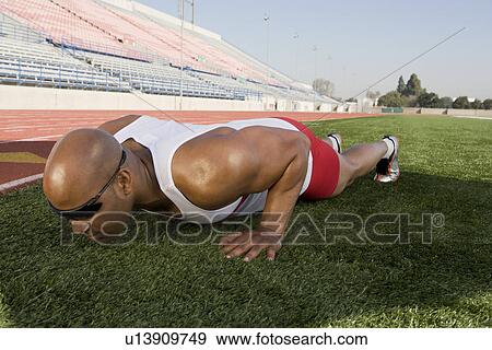 Athlete warming up before run View Large Photo Image Stock Photo - Athlete warming up before run. Fotosearch