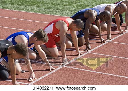 Athletes ready to run, high angle view View Large Photo Image Stock Image - Athletes ready to run, high angle view. Fotosearch