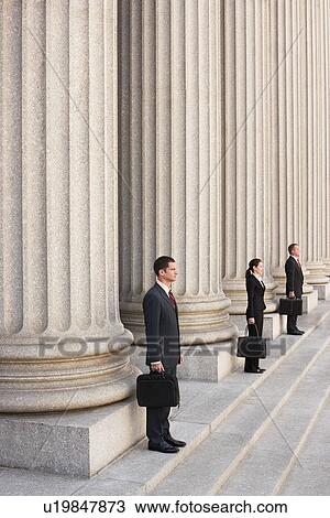 Stock Image - Attorneys waiting on courthouse steps. Fotosearch
