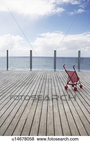 Baby stroller on wooden Dock View Large Photo Image Stock Photo - Baby stroller on wooden Dock. Fotosearch
