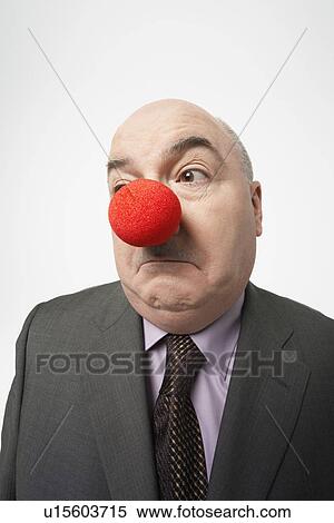 Bald businessman Wearing Clown Nose, frowning View Large Photo Image Stock Photography - Bald businessman Wearing Clown Nose, frowning. Fotosearch