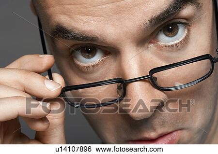 Balding man hand on glasses, making a face, close-up View Large Photo Image Stock Photograph - Balding man hand on glasses, making a face, close-up. Fotosearch