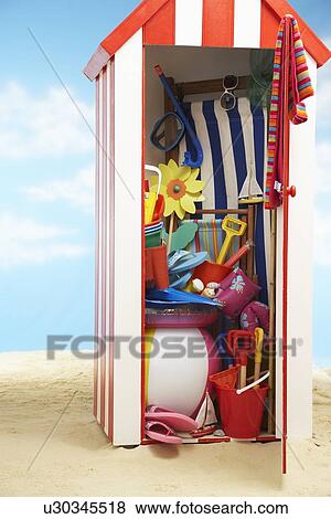 Beach storage cabin with beach toys View Large Photo Image Stock Photo - Beach storage cabin with beach toys. Fotosearch