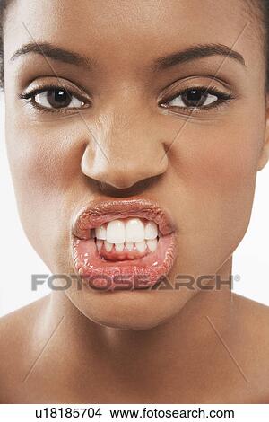 Picture - Beautiful Young Woman, making facial expression. Fotosearch