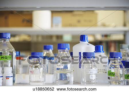 Stock Image - Bottles of chemicals in laboratory. Fotosearch