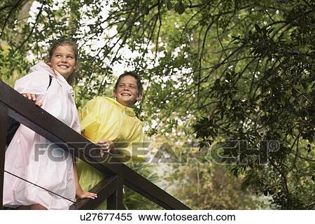 Stock Photography - Boy and Girl Spectating Plants. Fotosearch