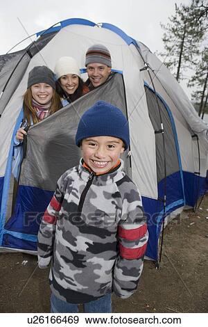Boy with family in front of tent, portrait View Large Photo Image Stock Photo - Boy with family in front of tent, portrait. Fotosearch