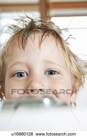 Boy with messy, wet hair, looking over edge of Bathtub, close-up View Large Photo Image Stock Photo - Boy with messy, wet hair, looking over edge of Bathtub, close-up. Fotosearch