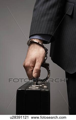 Briefcase Handcuffed to Businessman's Wrist View Large Photo Image Stock Image - Briefcase Handcuffed to Businessman's Wrist. Fotosearch