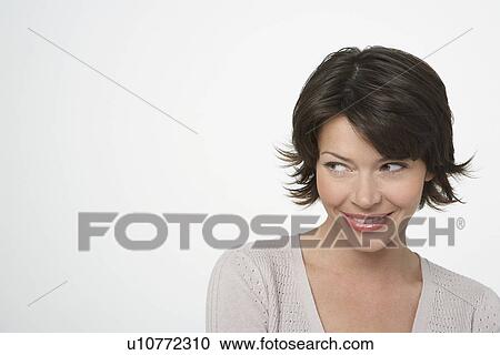 Stock Image - Brunette Woman looking to side. Fotosearch