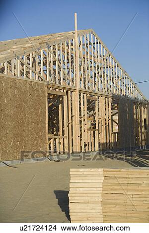 Building construction and stack of planks View Large Photo Image Picture - Building construction and stack of planks. Fotosearch