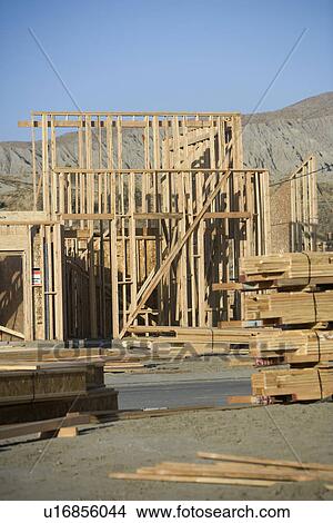 Picture - Building construction and stacks of planks. Fotosearch