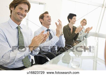 Business colleagues applauding in business meeting View Large Photo Image Stock Photo - Business colleagues applauding in business meeting. Fotosearch